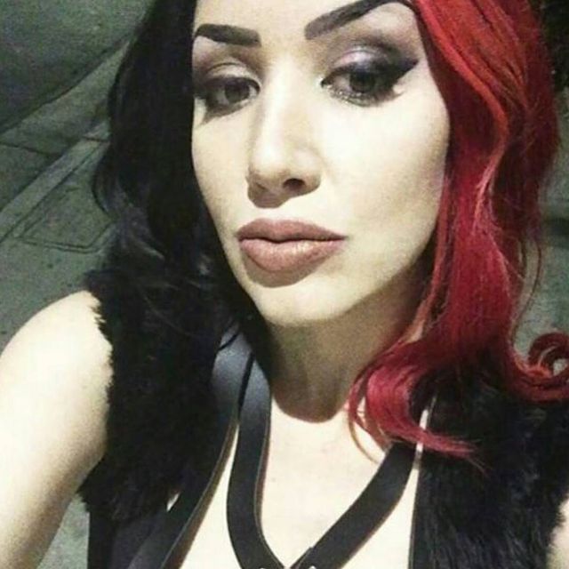 Ashley is wearing a black top.